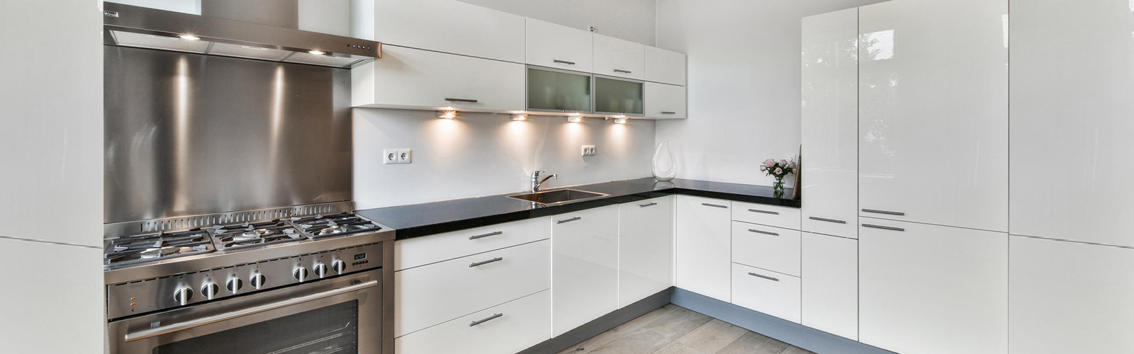 white laminate L shape kitchen design